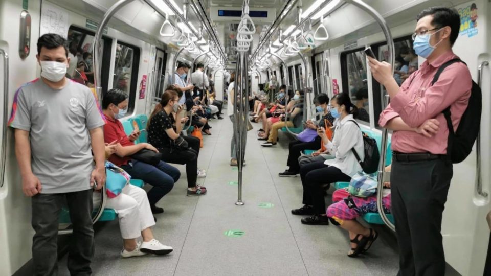 Commuters spread out on a train in Singapore in a photo posted April 20, 2020. Photo: Land Transport Authority/Facebook