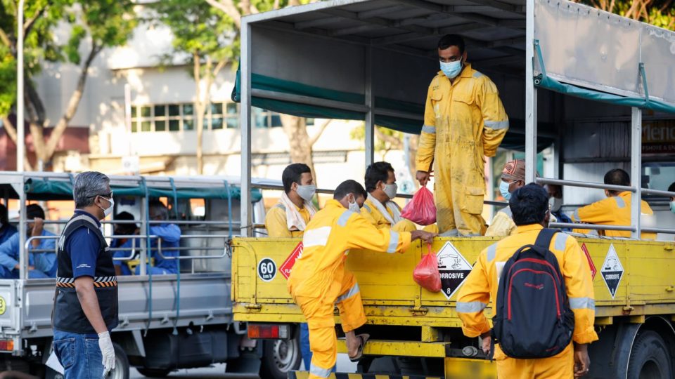 A Manpower Ministry official checks for safe-distancing compliance in a photo dated April 17, 2020. Photo: Ministry of Manpower/Facebook