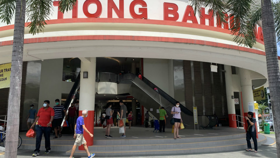 Masked Singaporeans visit the Tiong Bahru market on April 12, 2020. Photo: Coconuts