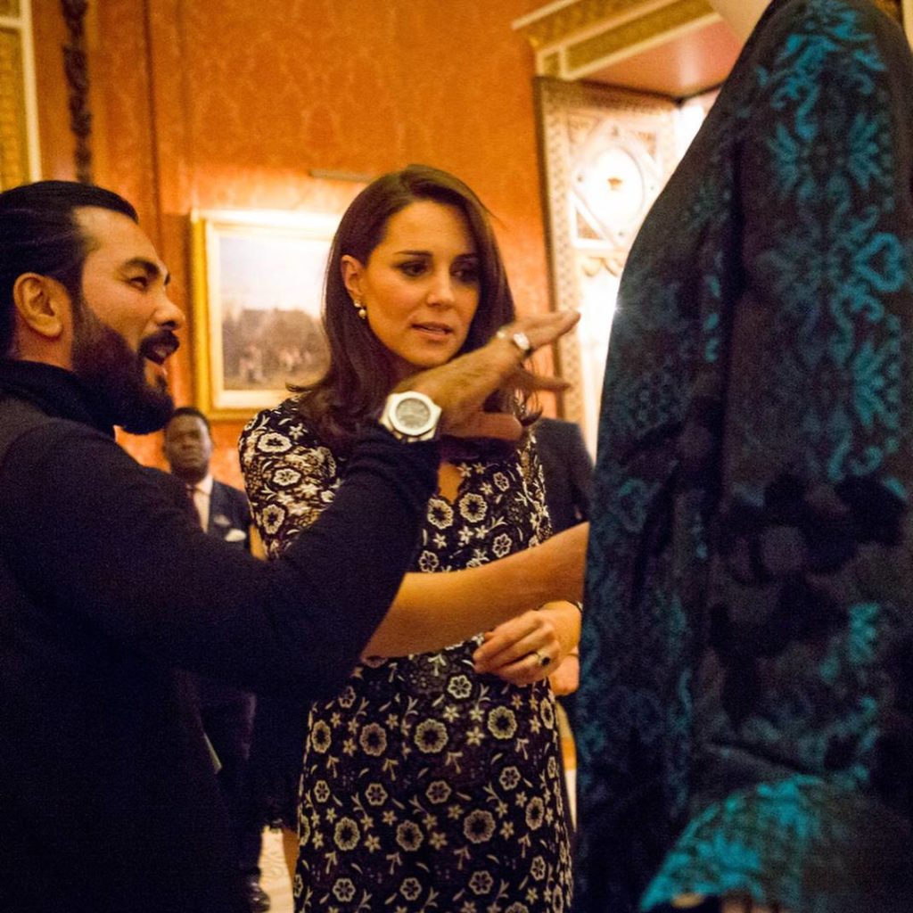 Kate Middleton takes an interest in Bernard Chandran’s creations at the Commonwealth Fashion Exchange. Photo: @bernardchandran