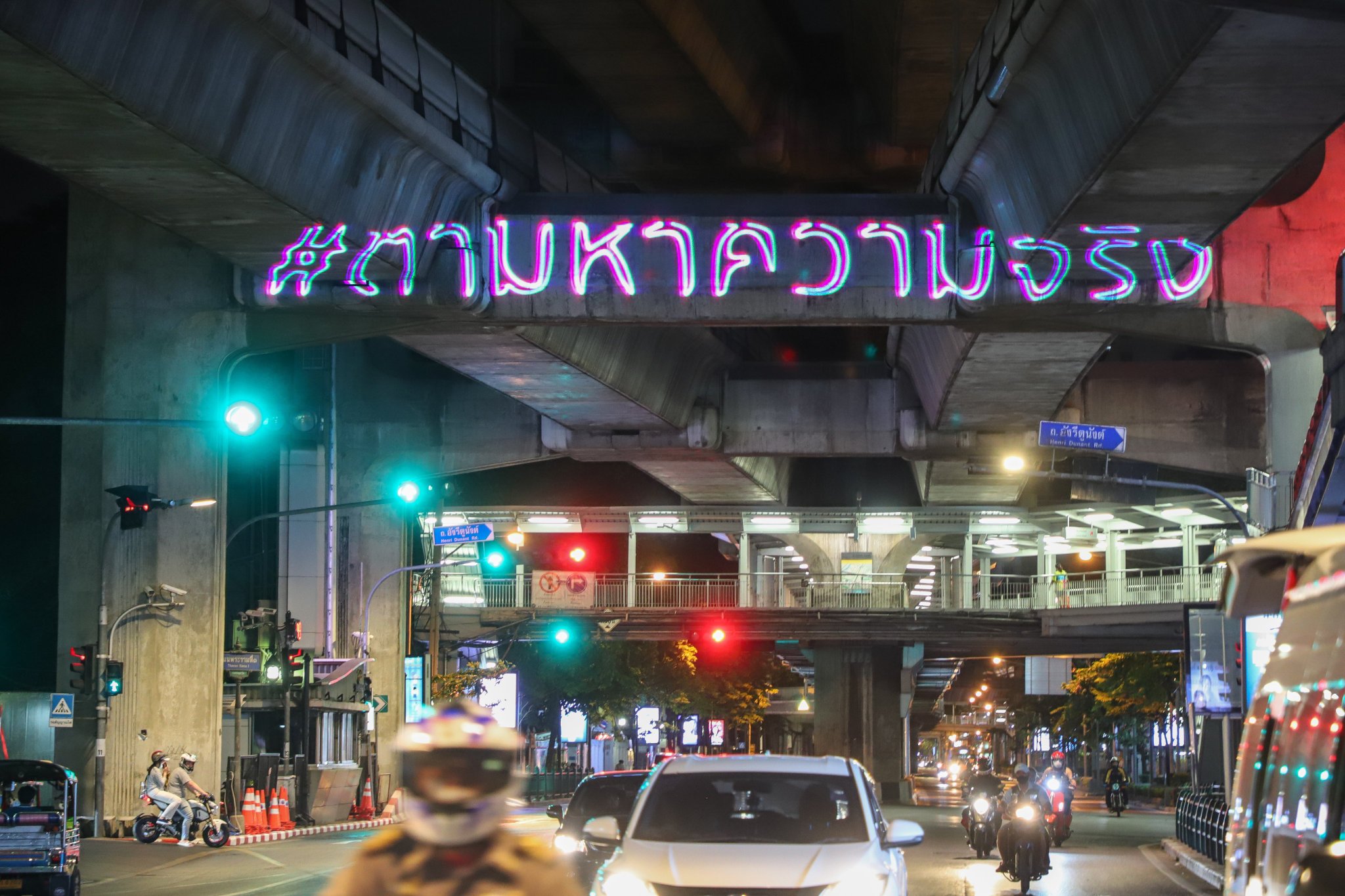 ‘Seek the truth’ reads a message projected Sunday night at BTS Victory Monument. Photo: The Reporters / Facebook