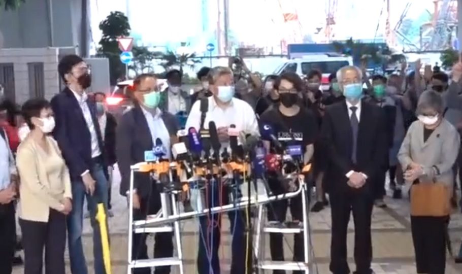 Many of the defendants met with the press outside the West Kowloon Magistrates’ Court today following their hearing. Screengrab: Apple Daily via Facebook