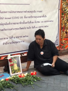 Phayaw Akkahad sat late Tuesday afternoon beside a memorial to her daughter Kamonked Akhad.