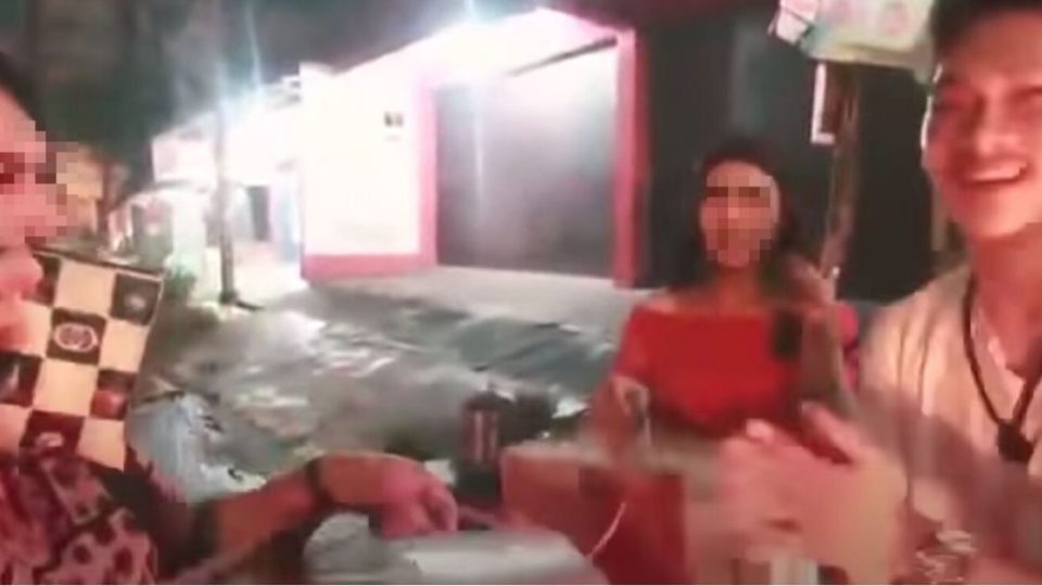 Screenshot of Ferdian Paleka’s video, in which he and some of his friends can be seen giving out fake aid packages to transwomen on the streets of Bandung, West Java. The instant noodle boxes they had prepared were actually filled with bricks and garbage.