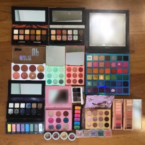 Lee shows us her collection of eyeshadow palettes and singles. Photo: Lee Ming Hui