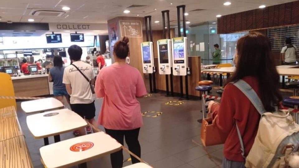 Customers queue at a McDonald’s outlet today. Photo: Legit Singapore/Facebook