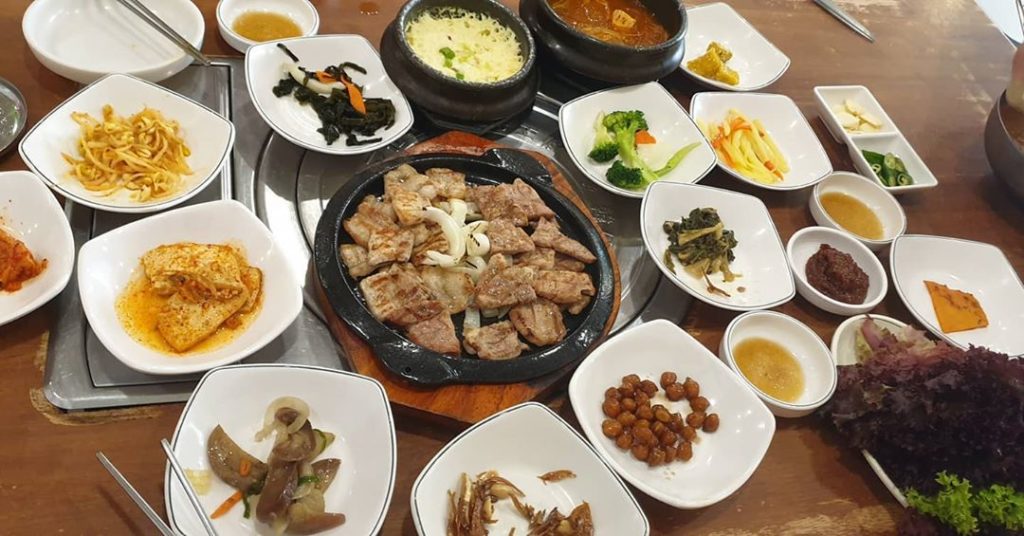 Korean barbecue dish surrounded by banchan. Photo: Sarah Leong /Instagram