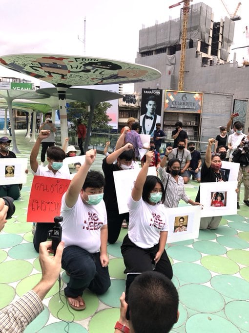 'Taking the knee' in what has become a gesture against state-sanctioned violence, protesters Friday evening gathered in Bangkok to demand answers one day after Thai exile Wanchalerm Satsaksit was reportedly abducted at gunpoint outside his residence in Phnom Penh. 