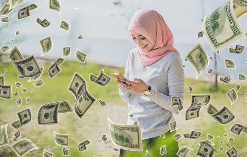 Photo illustrates a woman holding a phone as money rains down. Photo: ferli