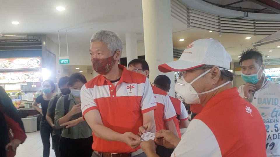 Lee Hsien Yang receives Progress Singapore Party membership card from Tan Cheng Bock. Photo: Yahoo/Facebook video