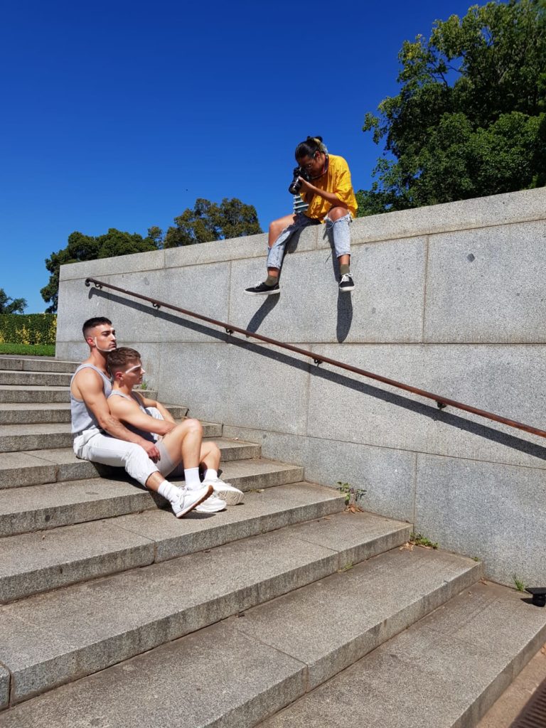 Daniel Adams (in yellow) photographing his subjects. Photo: Daniel Adams