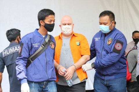 Convicted pedophile and alleged bitcoin scammer Russ Medlin presented to the media following his arrest in Jakarta. Photo: Jakarta Metro Police