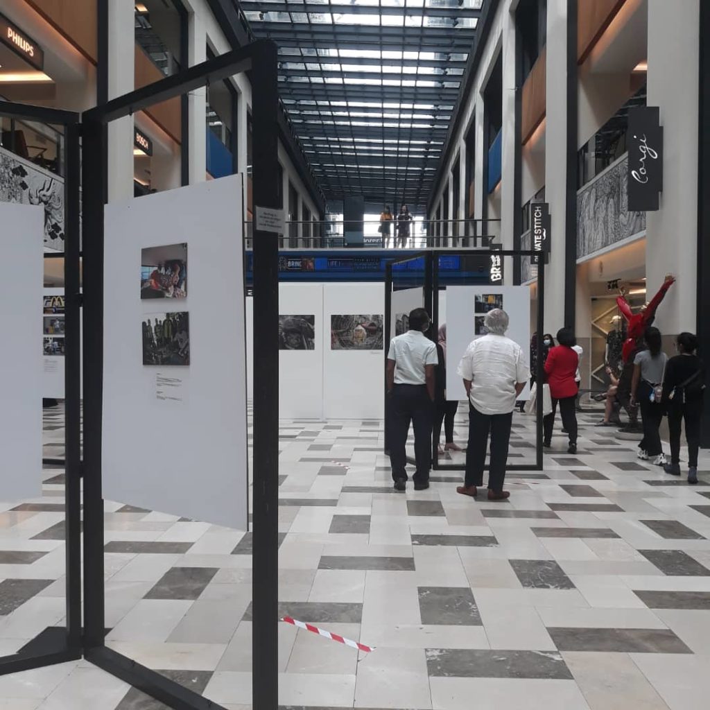 Visitors checking out the photos at the exhibition. Photo: Coconuts KL