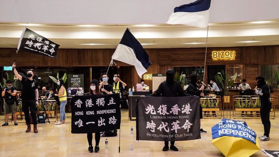 Hong Kong protesters wave flags at Pacific Place mall in Admiralty on June 15, 2020. Photo via Stromile Li for Daily Record/Facebook