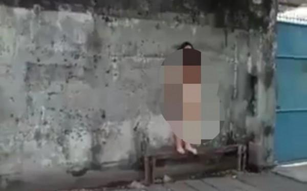 Screenshot from a video showing a naked dentist walking around in public in Surabaya in early June 2020. Photo: Istimewa