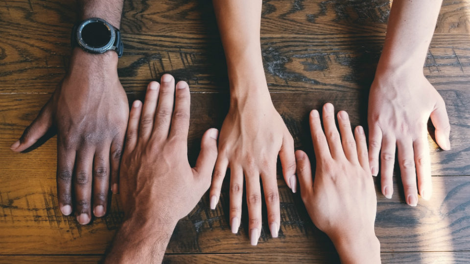 Hands by people of different colors. Photo: Clay Banks