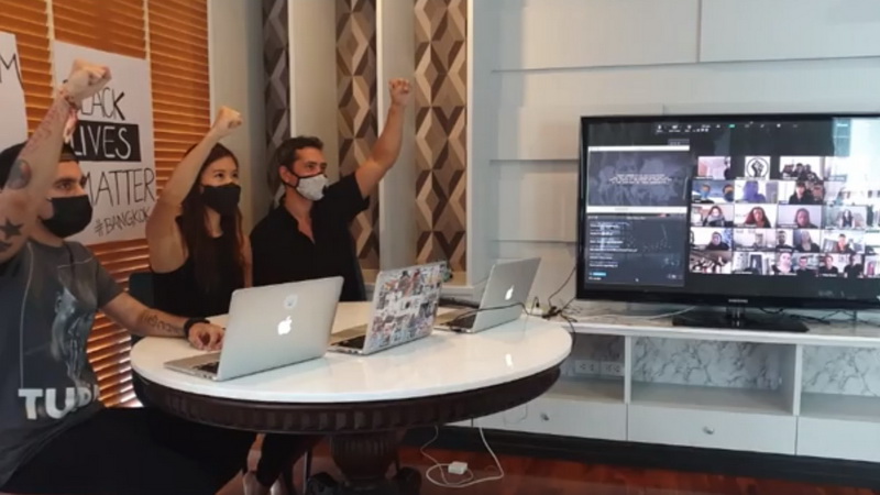 Organizers raise fists in support of the anti-racism movement in a meeting room at The Grand hotel Saturday in Bangkok’s Pathum Wan district. Image: Supporters of Black Lives Matter in Bangkok‎ / Facebook