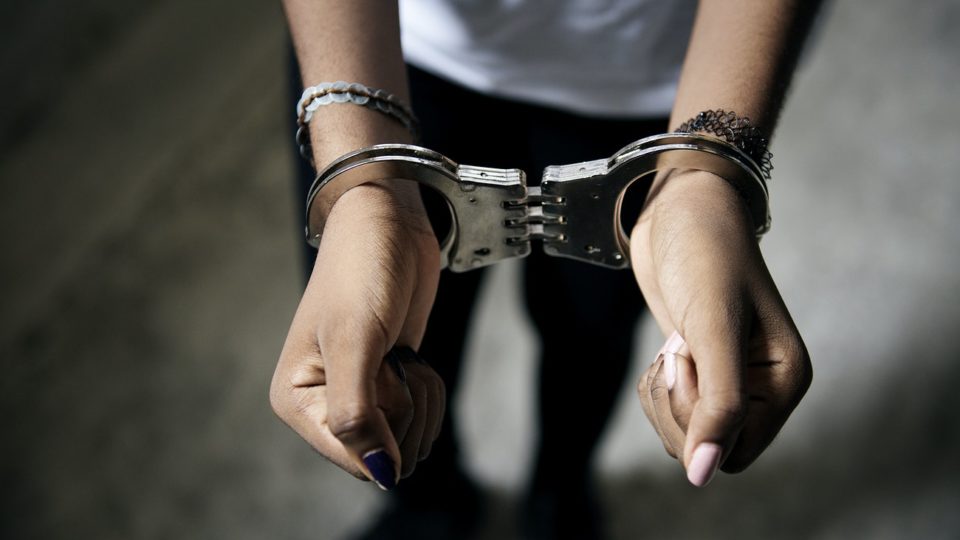 Photo illustrates a person in handcuffs. Photo: RawPixel