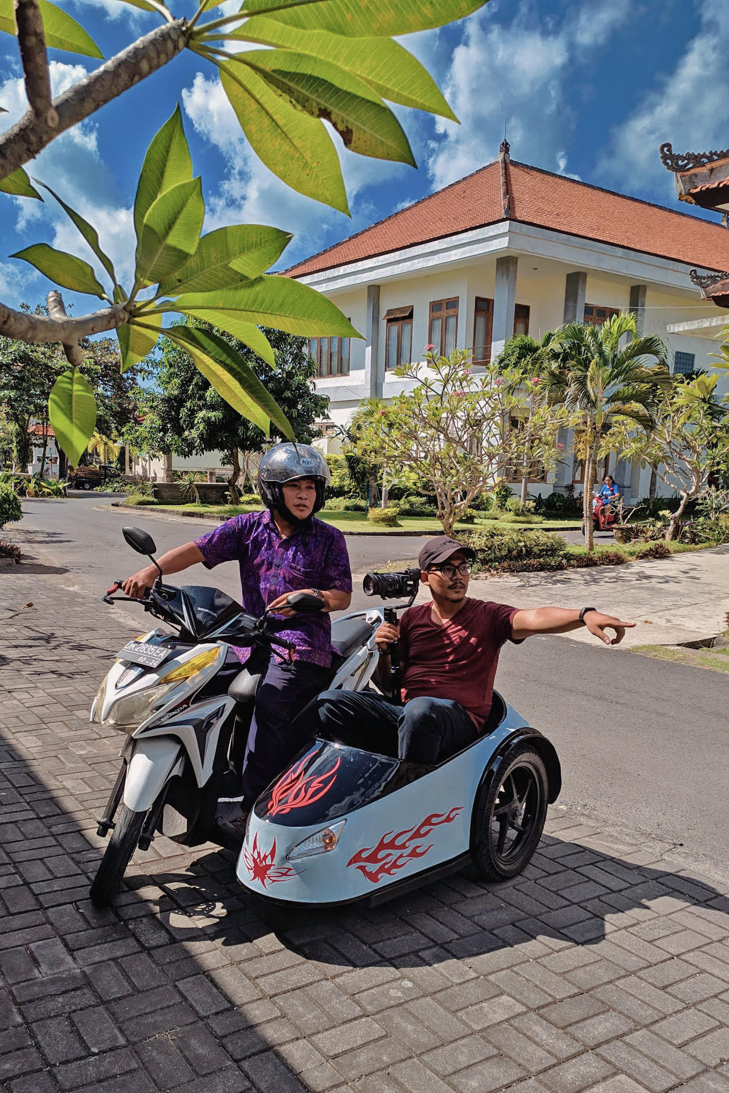 Anak Agung Ngurah Putra (left), an art teacher, and Satu Bumi Jaya’s Rarkyan Astungkara (right), while filming the Physical Disability episode of Difabel Kerja. Photo supplied