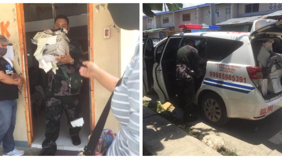 Bulacan police taking away copies of Pinoy Weekly magazine. Photo: Pinoy Weekly/FB