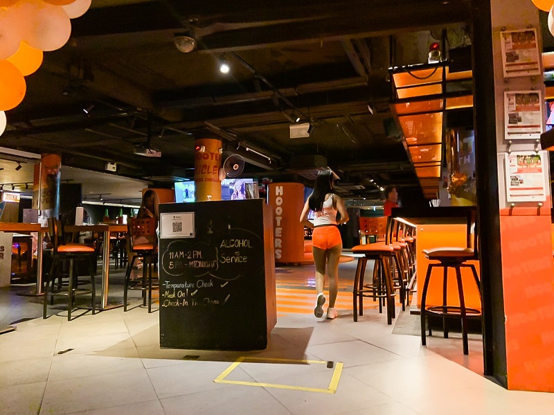 Few patrons were seated at Hooters in Soi Sukhumvit 4. 