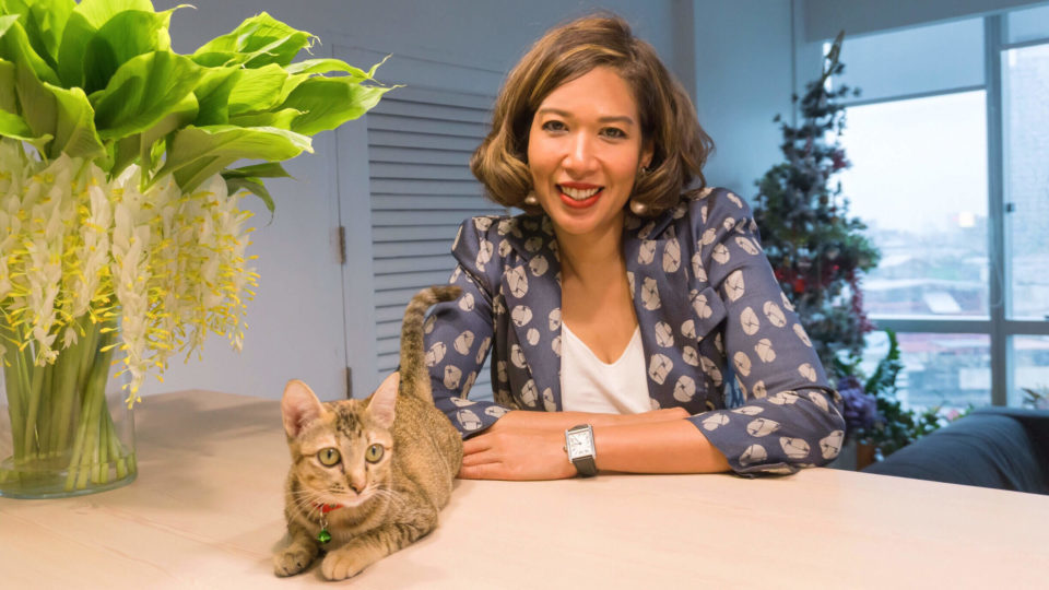 Niramon Serisakul, director of Urban Design and Development Center, and her muse Passepartout, whom she rescued from the recently opened Chao Phraya Sky Park. 
