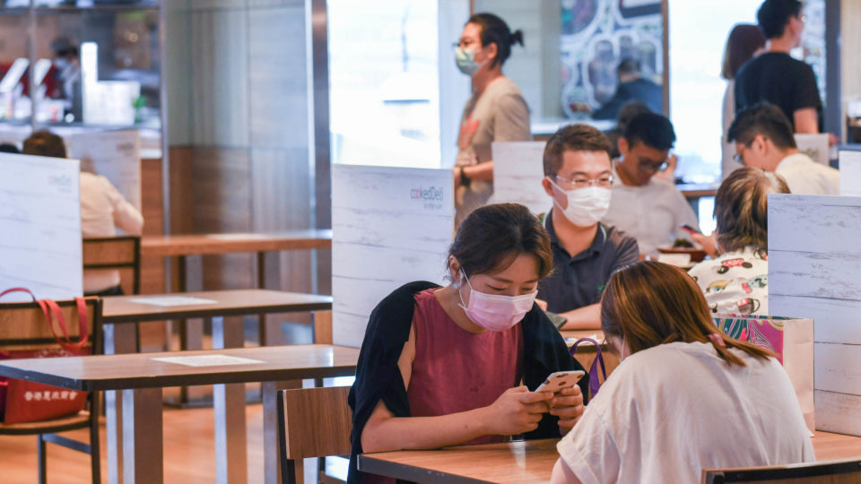 Diners eat at a food court on July 16, 2020. Photo via the Hong Kong government Information Services Department