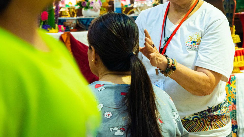 Reiki healing in action. Photo: Jason Chen via Thekchen Choling Singapore/Facebook