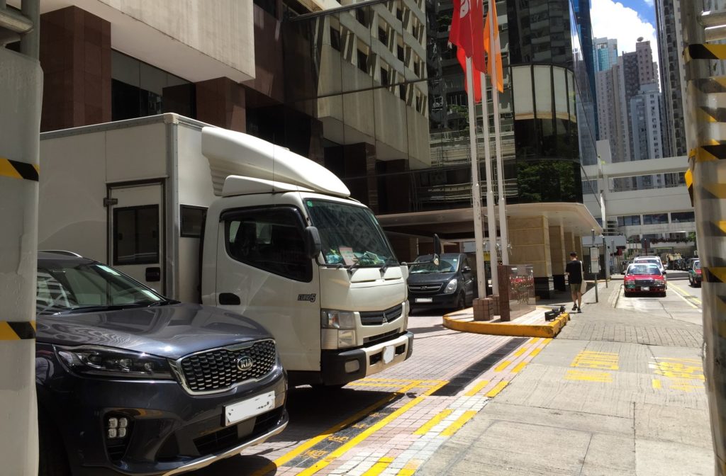 Cars parked outside City Garden Hotel on Aug. 14, 2020. Photo: Coconuts Media/Christy Kan