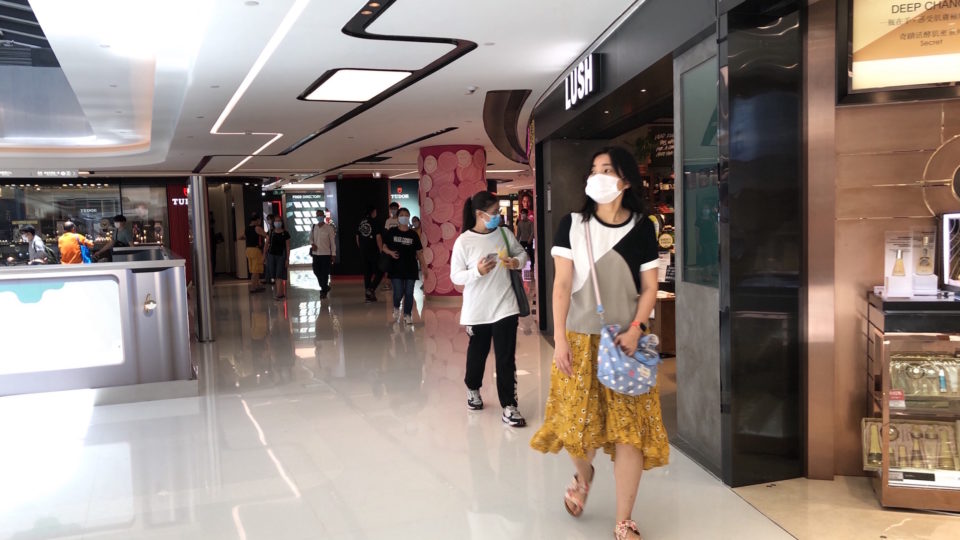 Shoppers walk in New Town Plaza Phase 3 in Sha Tin on Aug. 12, 2020.
