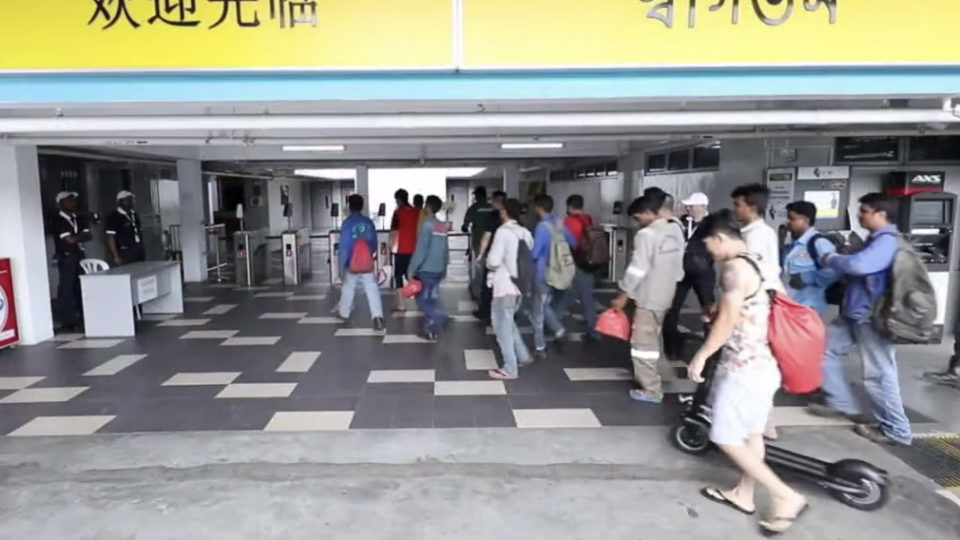 Migrant workers entering a dormitory in Singapore. Image: Ministry of Manpower