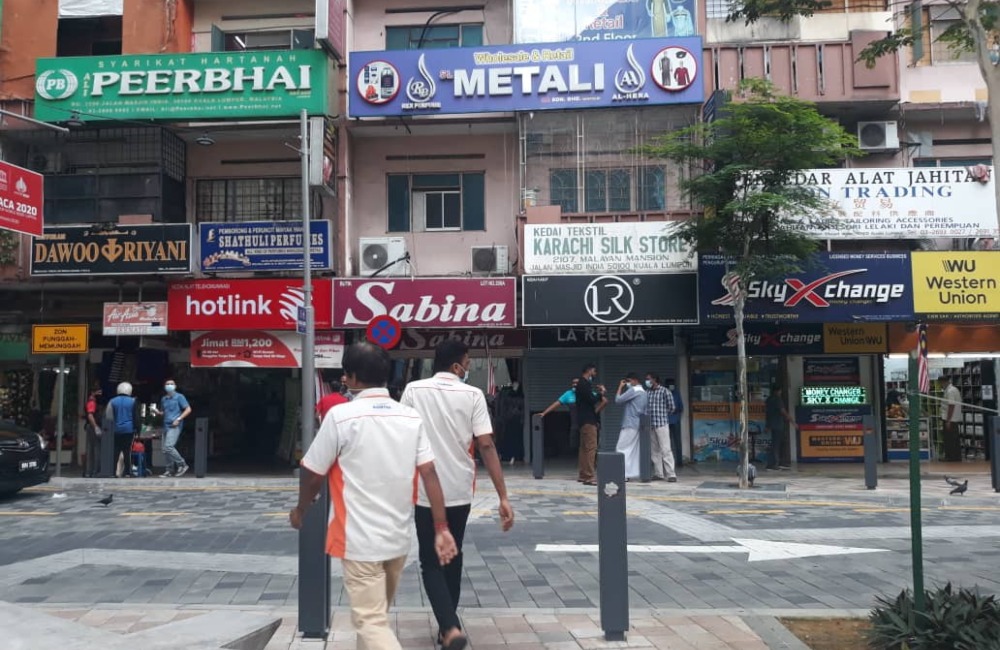 Handful of people along Jalan Masjid India. Photo: Coconuts KL