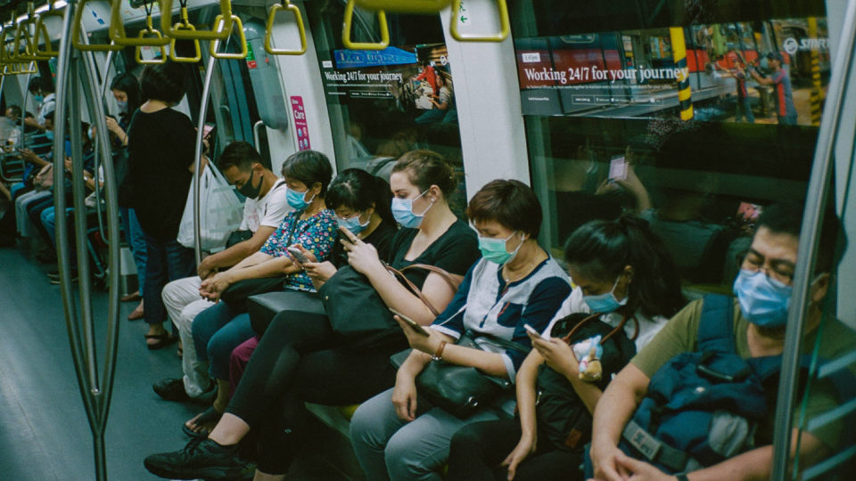Commuters wear face masks on the train in Singapore. Photo: Shawn Ang