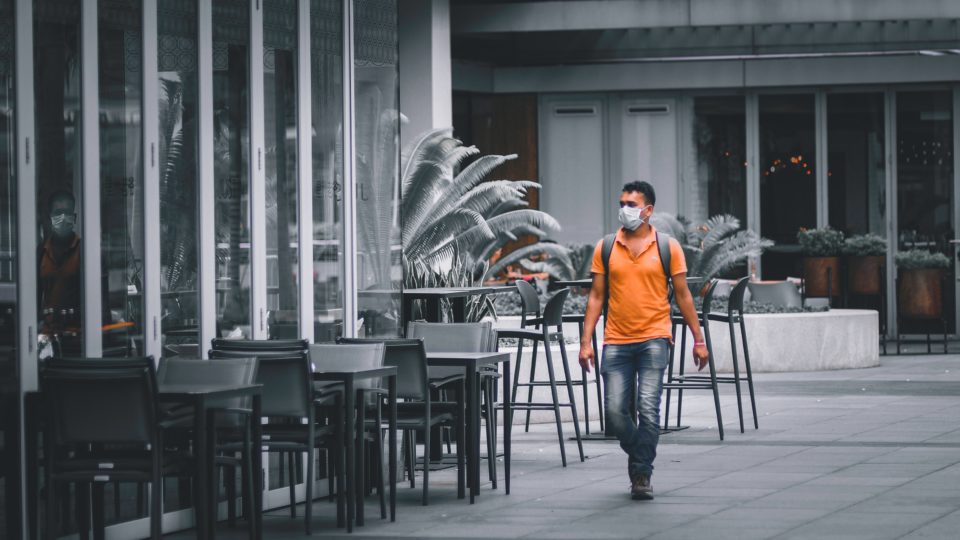 Man in a face mask walks outside Marina Bay Sands. Photo: Victor He