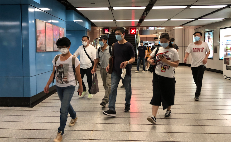 Commuters walk through Kowloon Tong Station on Aug. 18, 2020. Photo: Coconuts Media