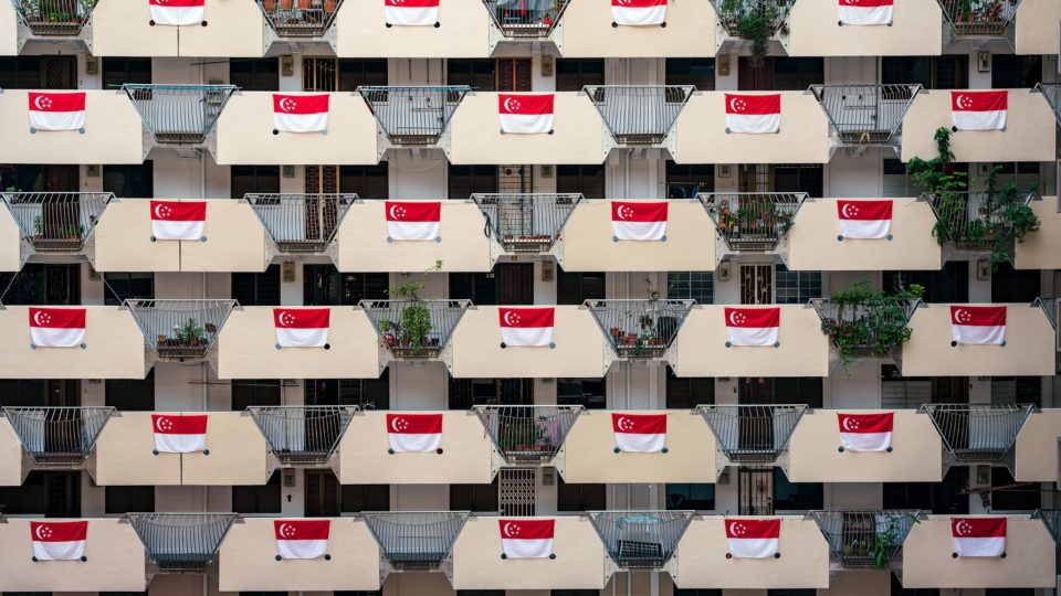 Singapore flags hanging outside a housing block. Photo: Edwin Tong/Facebook
