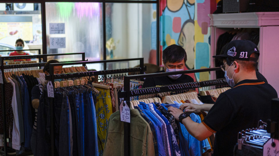 Shoppers browse the racks at 1ofaKind. Photo courtesy of ImpactHK
