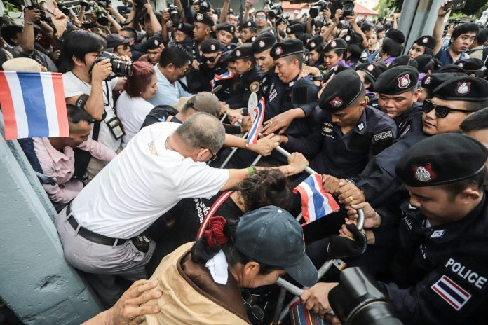 Pro-democracy activists mark the 2014 coup’s fourth anniversary with a march to the Government House on May 22, 2018, from Thammasat University’s Tha Prachan campus. Photo:  Chayanit Itthipongmaetee