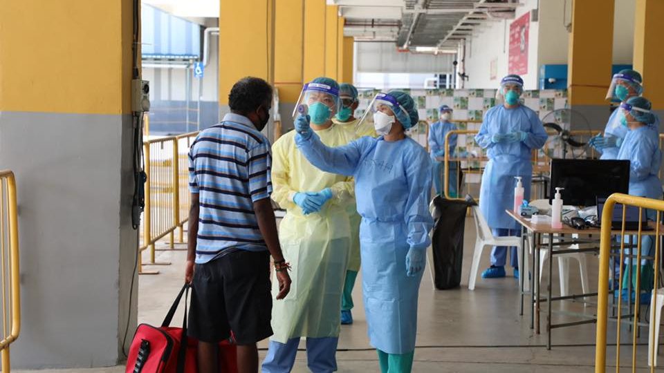 A medical team attending to a migrant worker at Tuas South Dormitory. Image: Amrin Amin/Facebook
