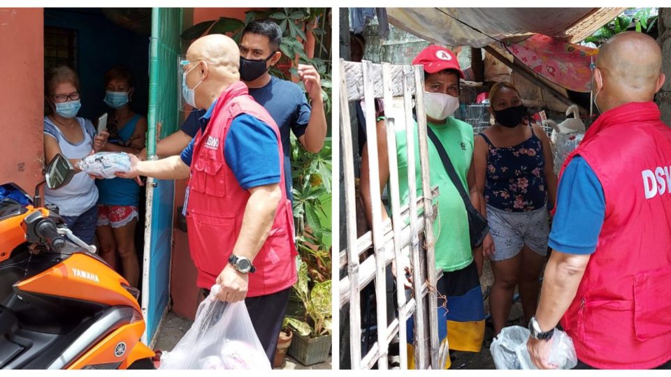 A government official gives relief goods to residents. Photo: Department of Social Work and Development/FB