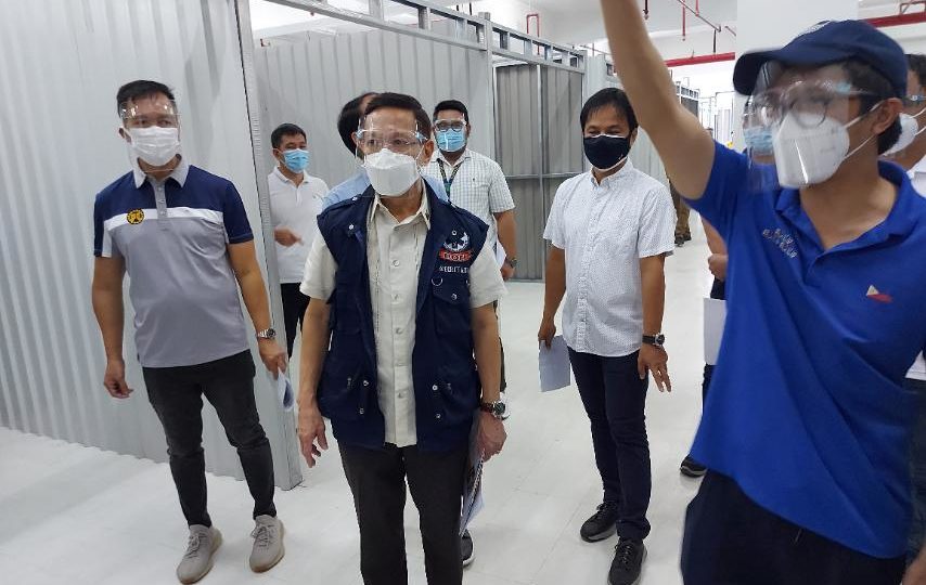 Health Secretary Francisco Duque inspecting a COVID-19 isolation center. Photo: Department of Health/FB