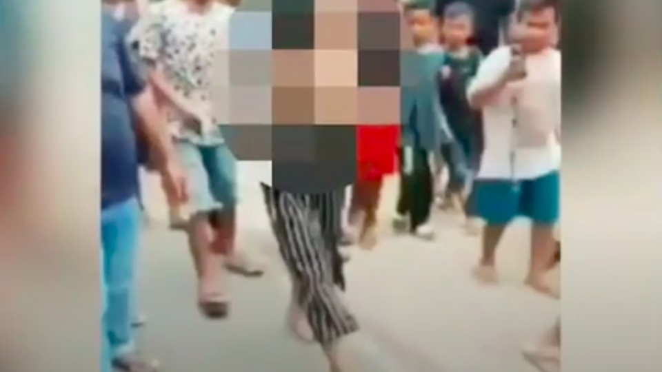 Indonesian woman stripped to her bare chest and paraded on the streets of a village as punishment for getting intimate with a man. Photo: Video screengrab