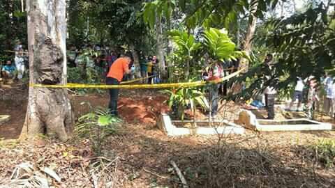 Police line around the vicim’s grave. Photo: Facebook
