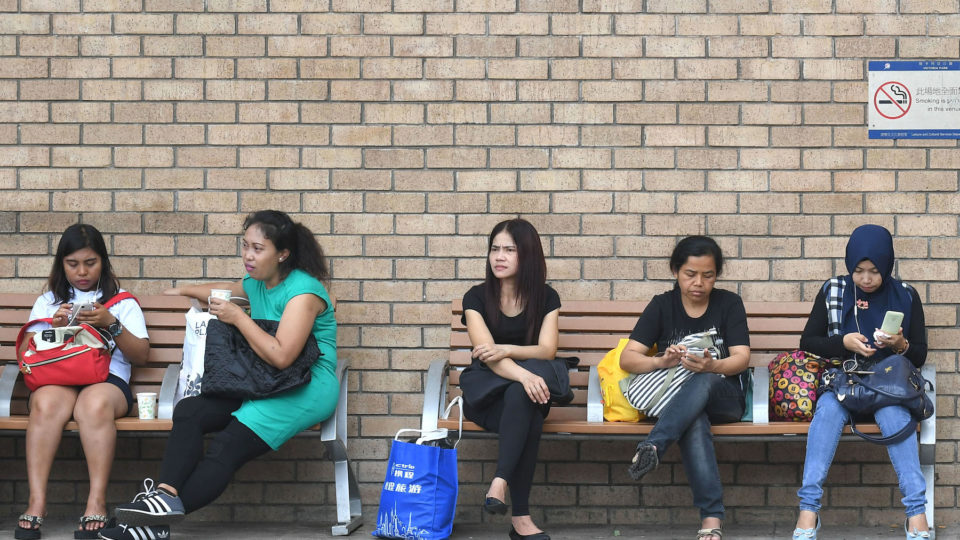 Domestic workers on their rest day at Victoria Park, Causeway Bay. Photo via the Hong Kong government’s Information Services Department