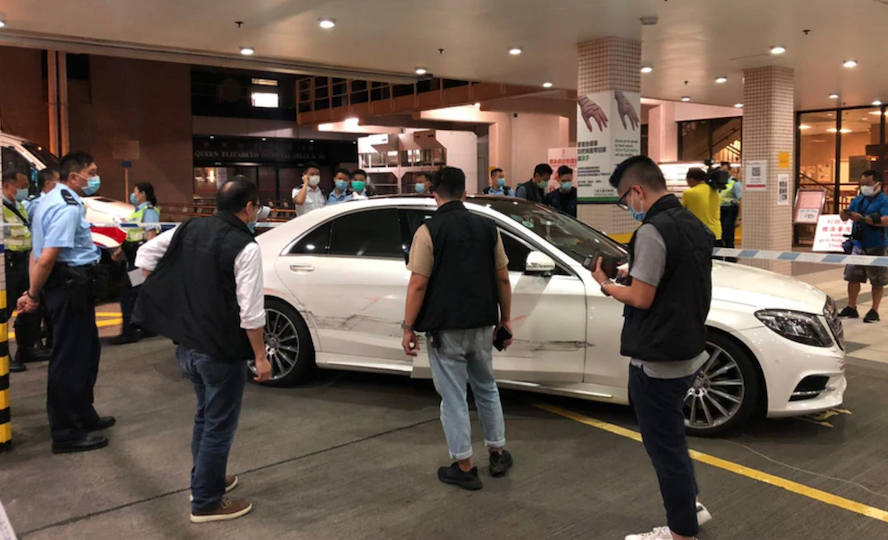 Police outside Queen Elizabeth Hospital inspect the Mercedes Benz vehicle involved in the shooting on Sept. 8, 2020. Photo via Apple Daily