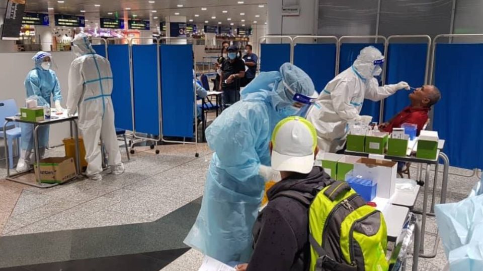 Medical staff giving COVID-19 swab tests to passengers at the Kuala Lumpur International Airport. Photo: Ministry of Health/Facebook