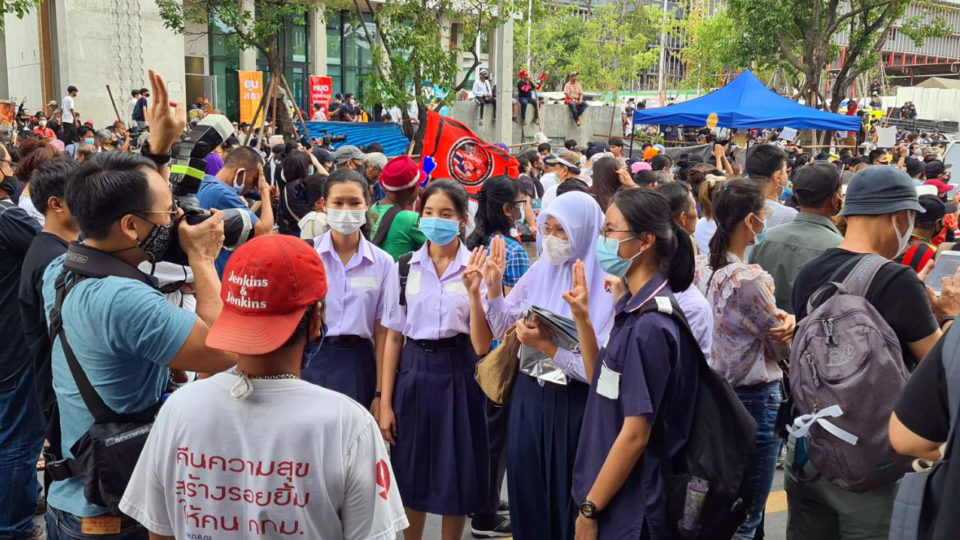 Protesters gather Thursday outside the new, unfinished parliament building. Photo: Coconuts