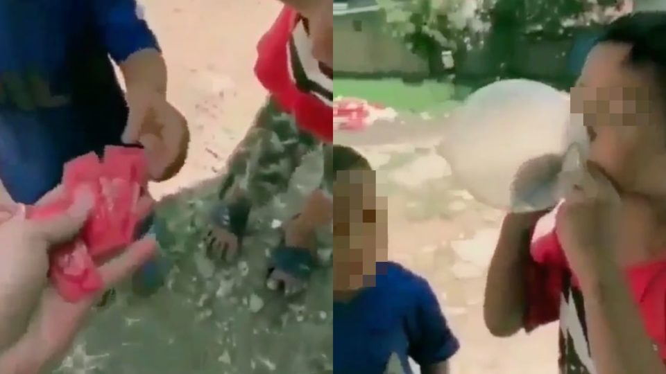 In the video, the man called the two boys and asked them if they wanted balloons. Instead of giving them two deflated balloons, he handed a condom each. Screenshot from video