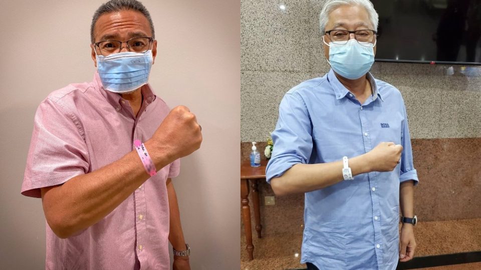 Foreign Affairs Minister Hishammuddin Hussein, at left, and Defence Minister Ismail Sabri pose with quarantine tags. Photos: Hishammuddin Hussein/Twitter, Ismail Sabri Yaakob/Facebook
