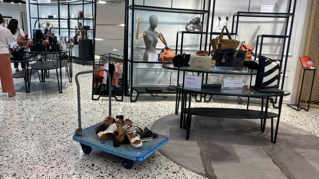 A random trolley of unwanted shoes at The Heeren outlet. Photo: Coconuts